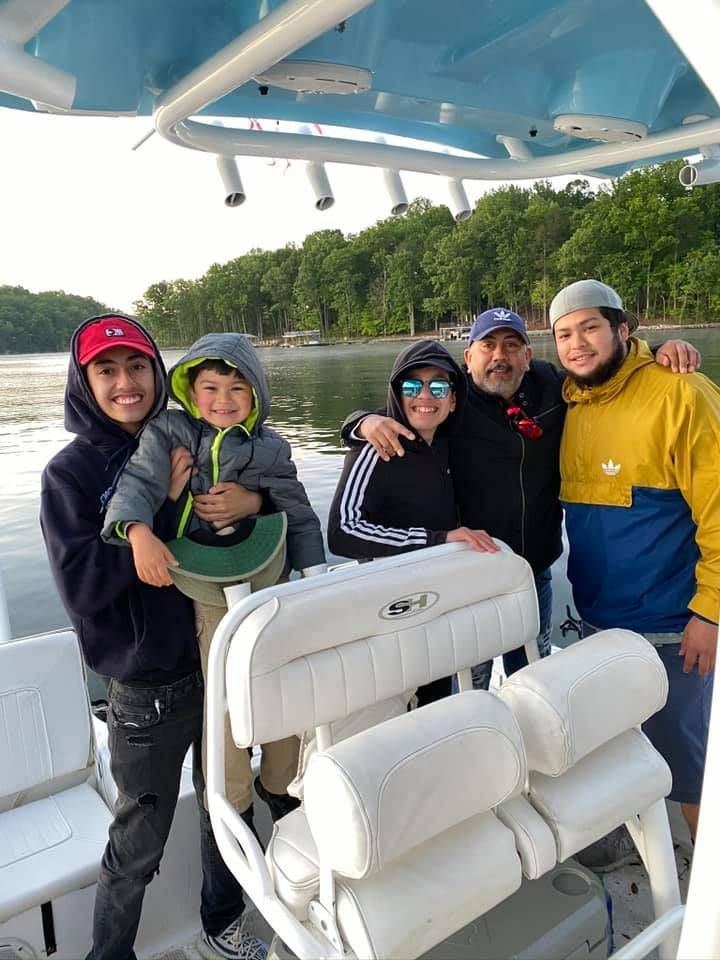 5 people fishing in unknown location