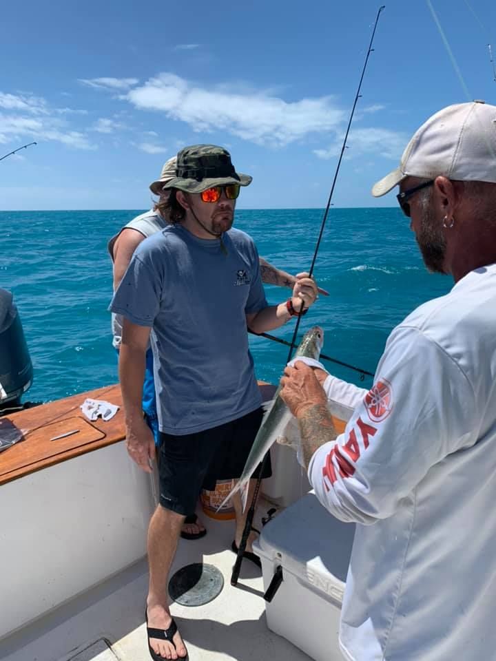 Person fishing in unknown location