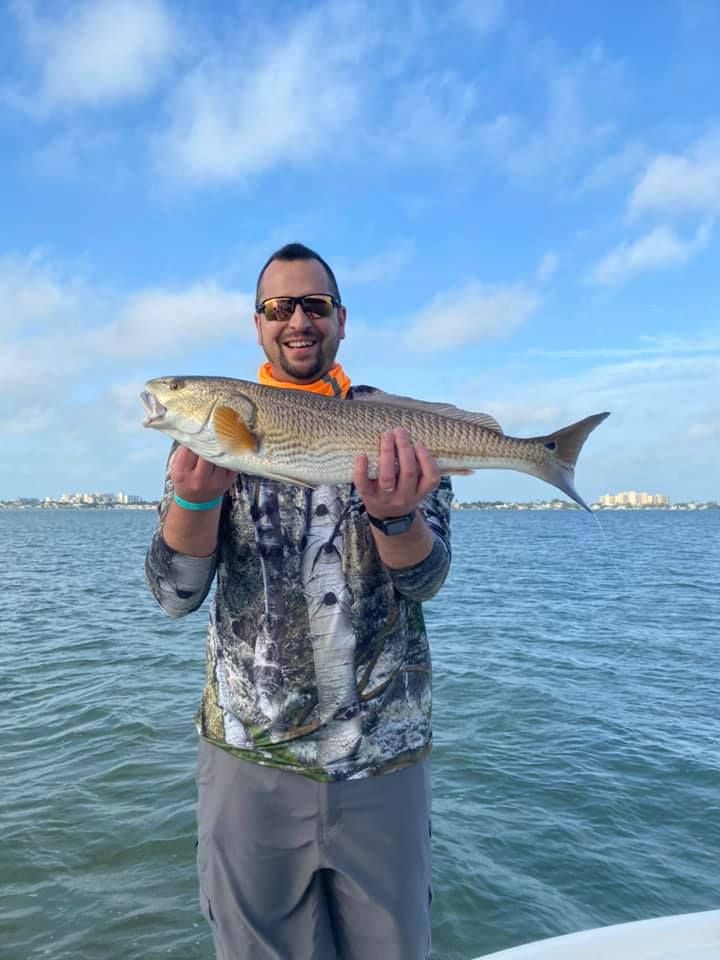 Angler with a large redfish catch