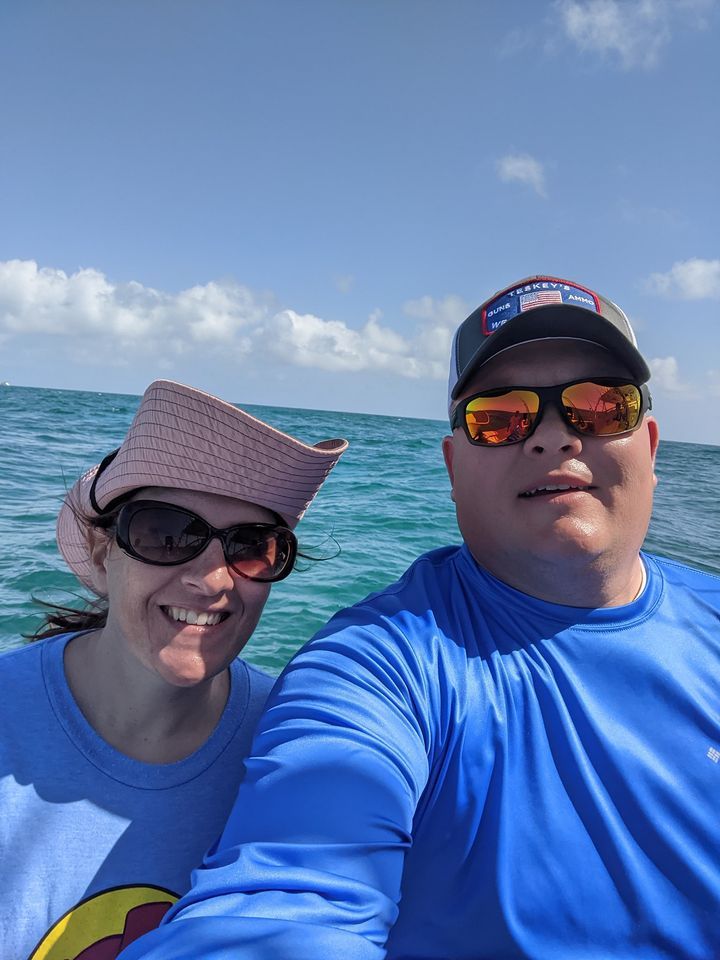 Two people fishing in a scenic location