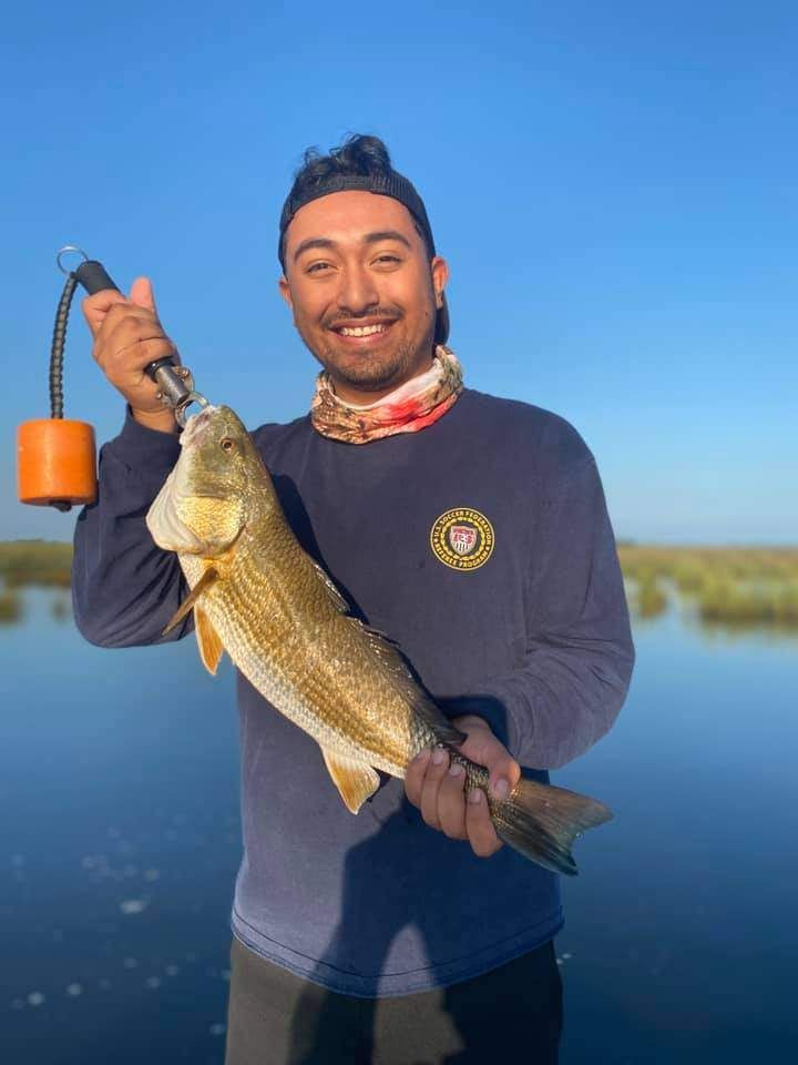 Person fishing in unknown location