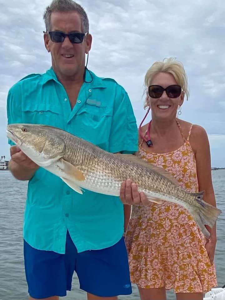 Angler fishing with rod and reel in unknown location