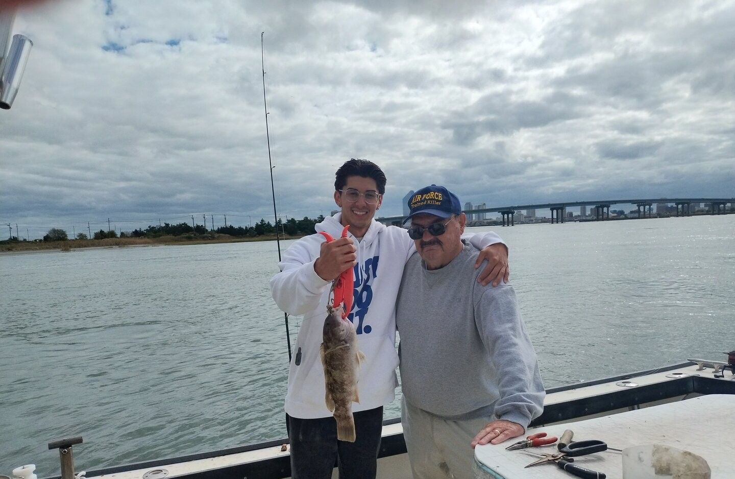 Two anglers fishing in an unknown location
