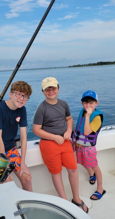 Three anglers fishing in an unknown location