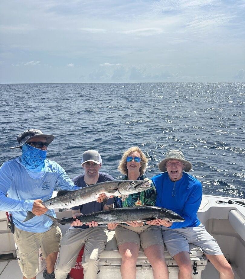 Fishing charter displaying catch of Great Barracuda and King Mackerel on boat deck