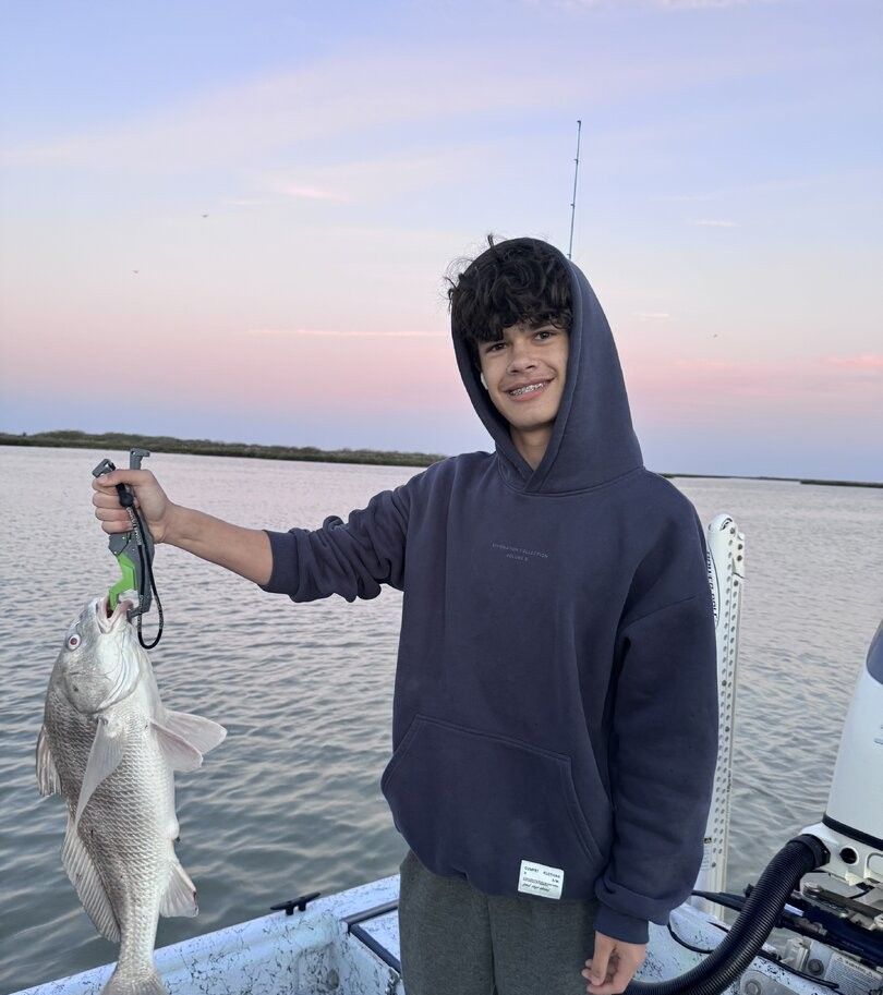 Black drum fish caught during fishing trip on boat