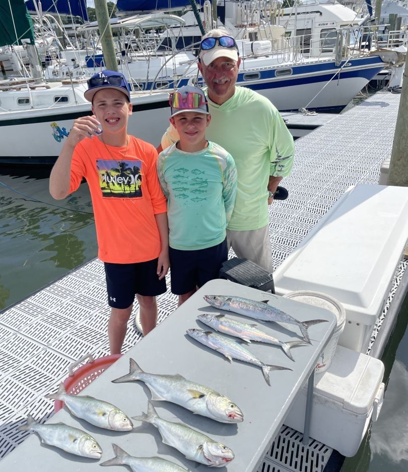 Fresh caught bluefish, king mackerel, and spanish mackerel displayed on boat dock