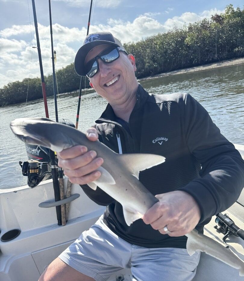 Bonnethead shark catch on fishing boat with fishing rods in background