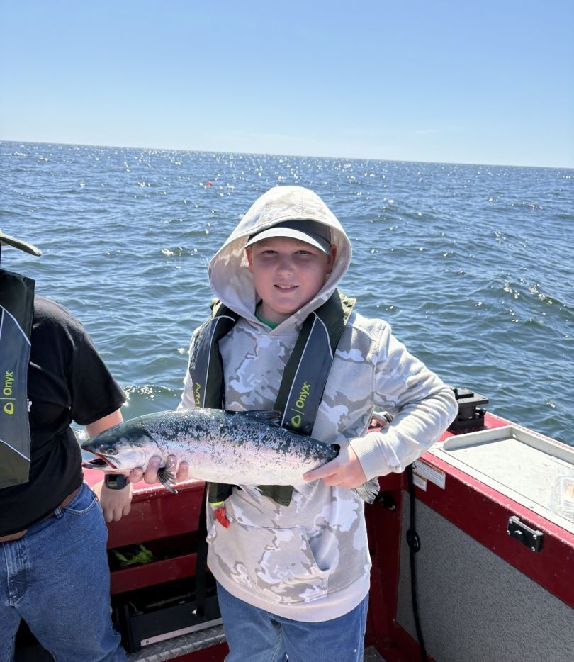 Angler casting line in fishing for brook trout