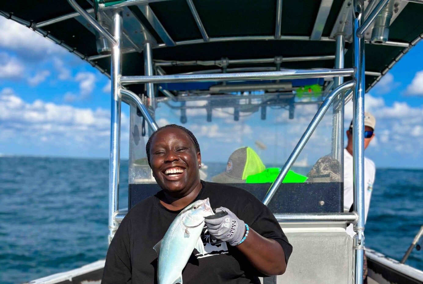 A person fishing at an unknown location