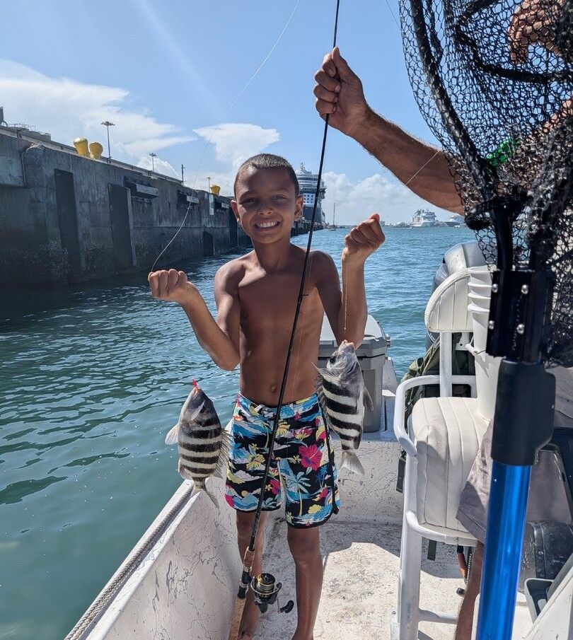 Two sheepshead fish caught while fishing from a boat