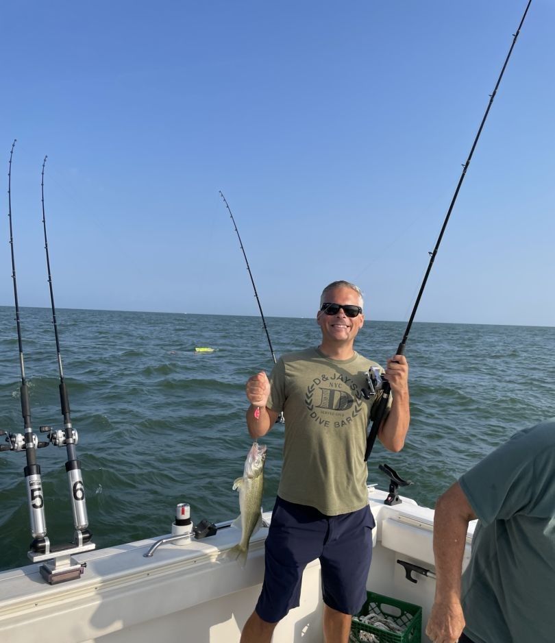 A person fishing in an unknown location