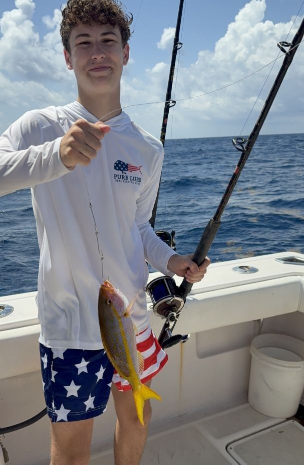Fisherman with fishing rod at unknown location