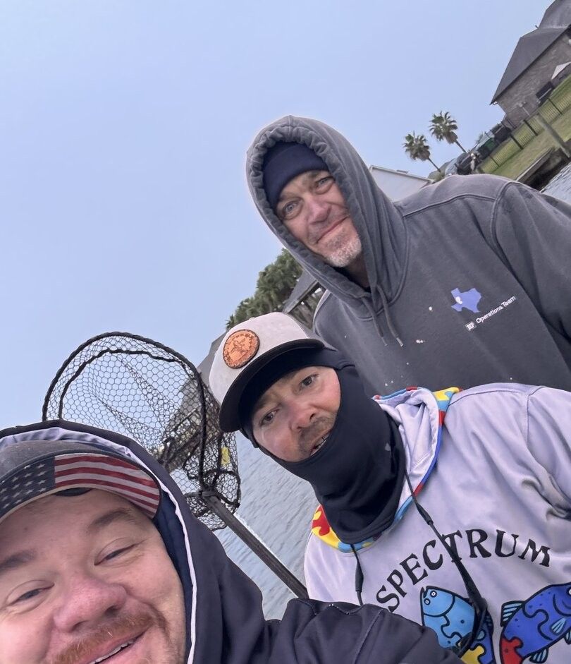 Fishing group with net equipment preparing for outdoor fishing activity