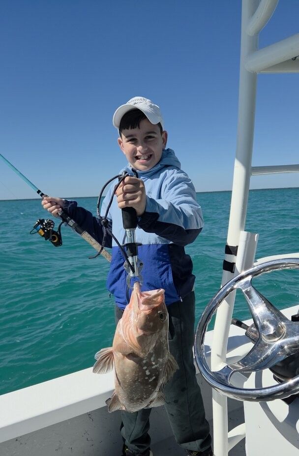 Red grouper caught during offshore fishing trip on boat
