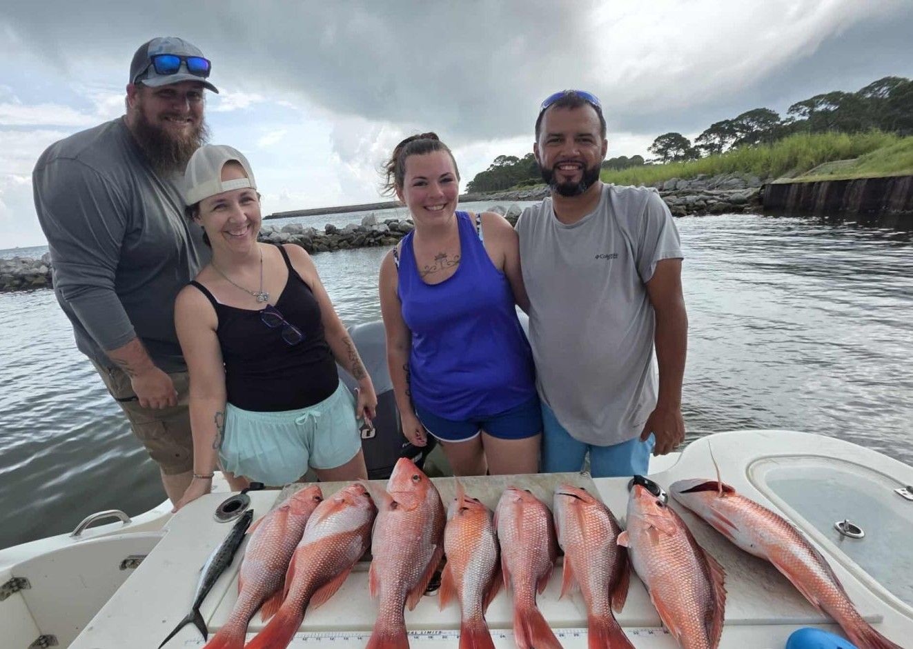 Successful fishing trip displaying seven red snapper caught on boat