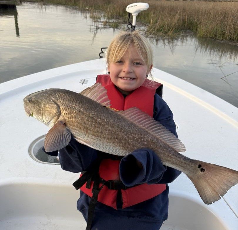 Large redfish caught during fishing trip on boat