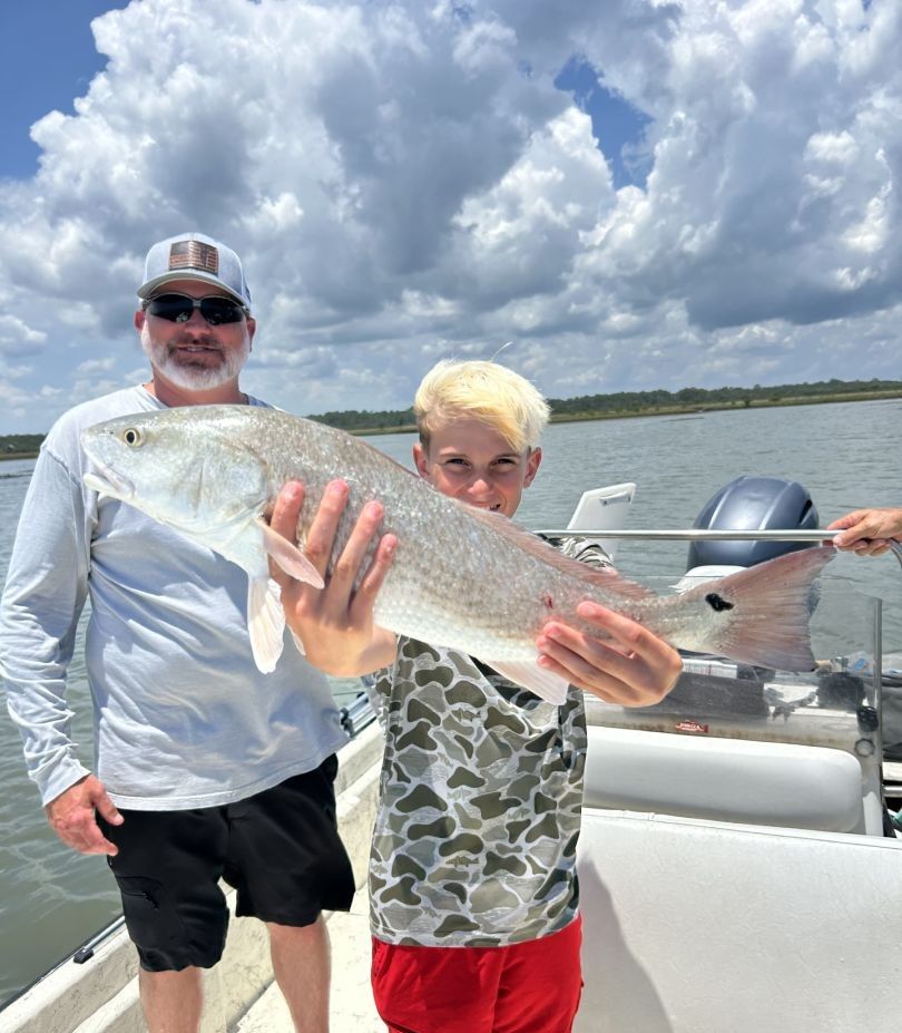 Freshly caught redfish displayed on fishing boat