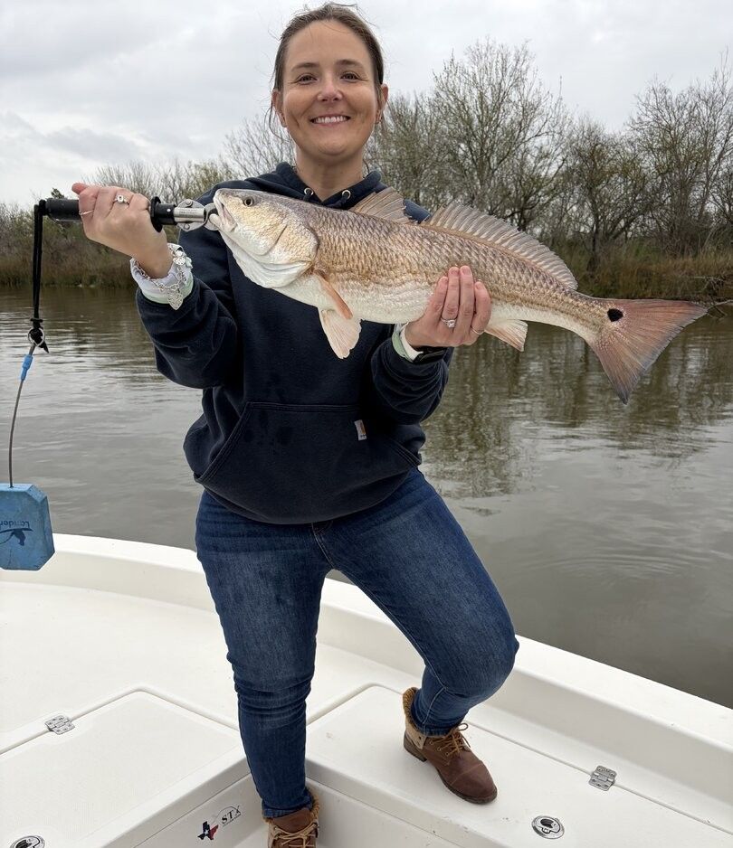 Redfish caught while fishing on boat in muddy water