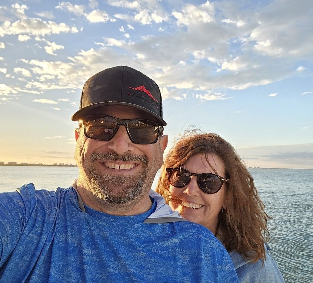 Two people fishing in a scenic location