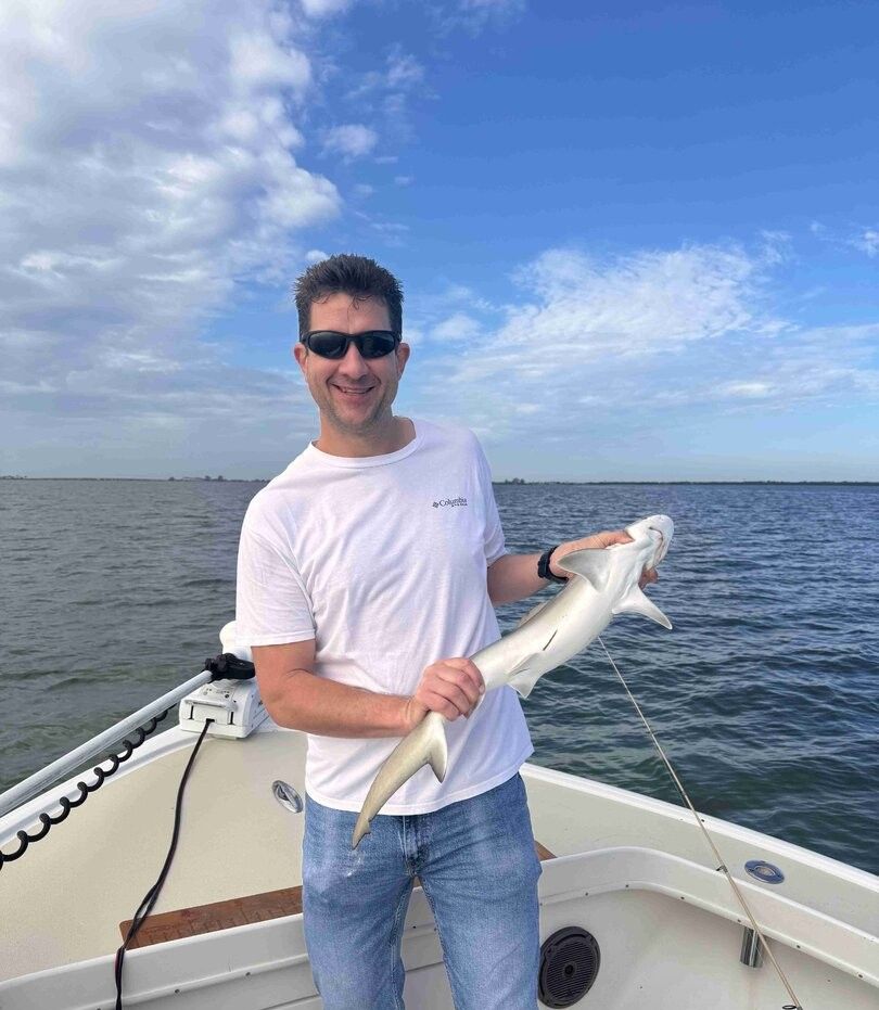 Shark caught while fishing on boat in open water