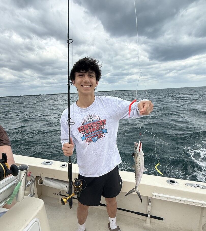 Spanish mackerel caught while fishing on boat in ocean waters