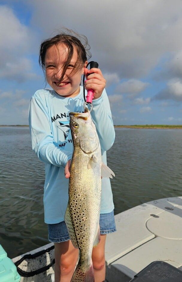 Speckled trout caught while fishing on a boat