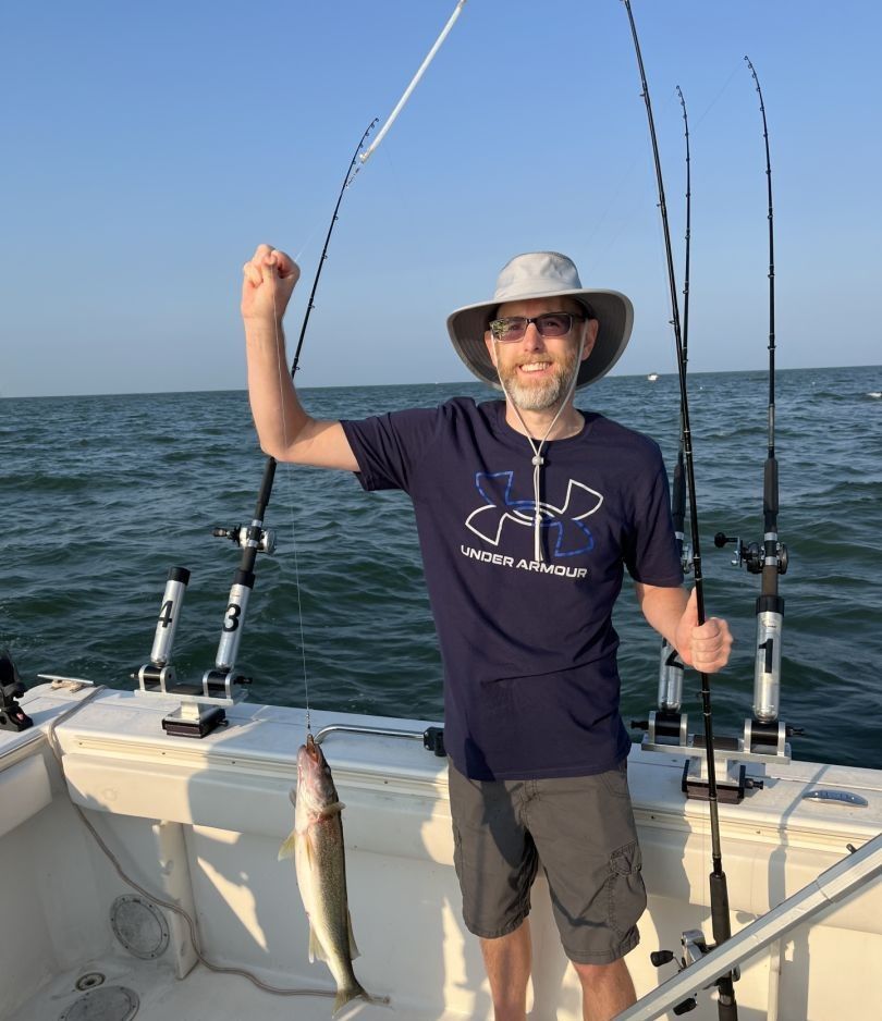 Fisherman enjoying a day of fishing at unknown location