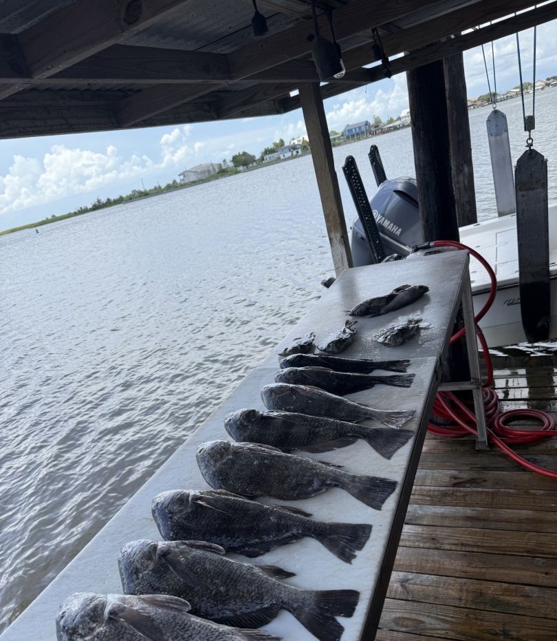 Two fishermen enjoying a day of fishing at an unknown location.