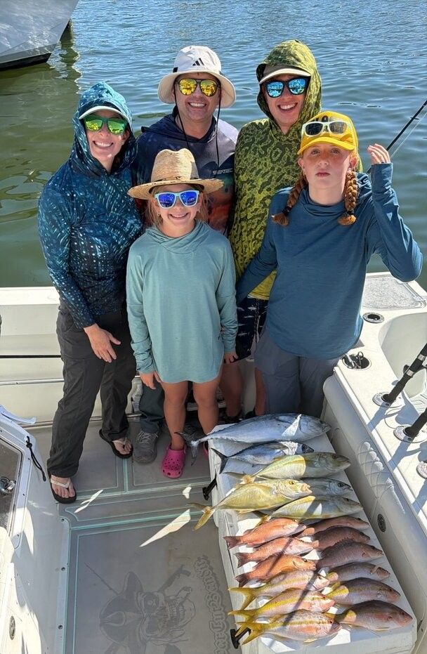 Successful fishing trip showing fresh caught fish displayed on boat deck