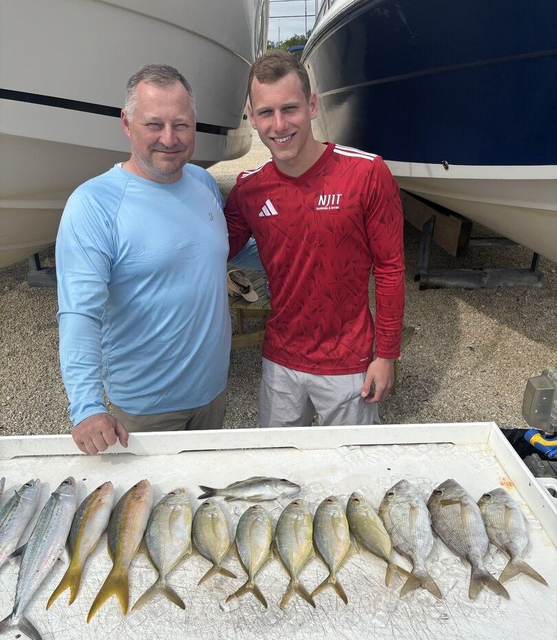 Fresh catch of yellowfin and cero mackerel displayed on fishing boat deck