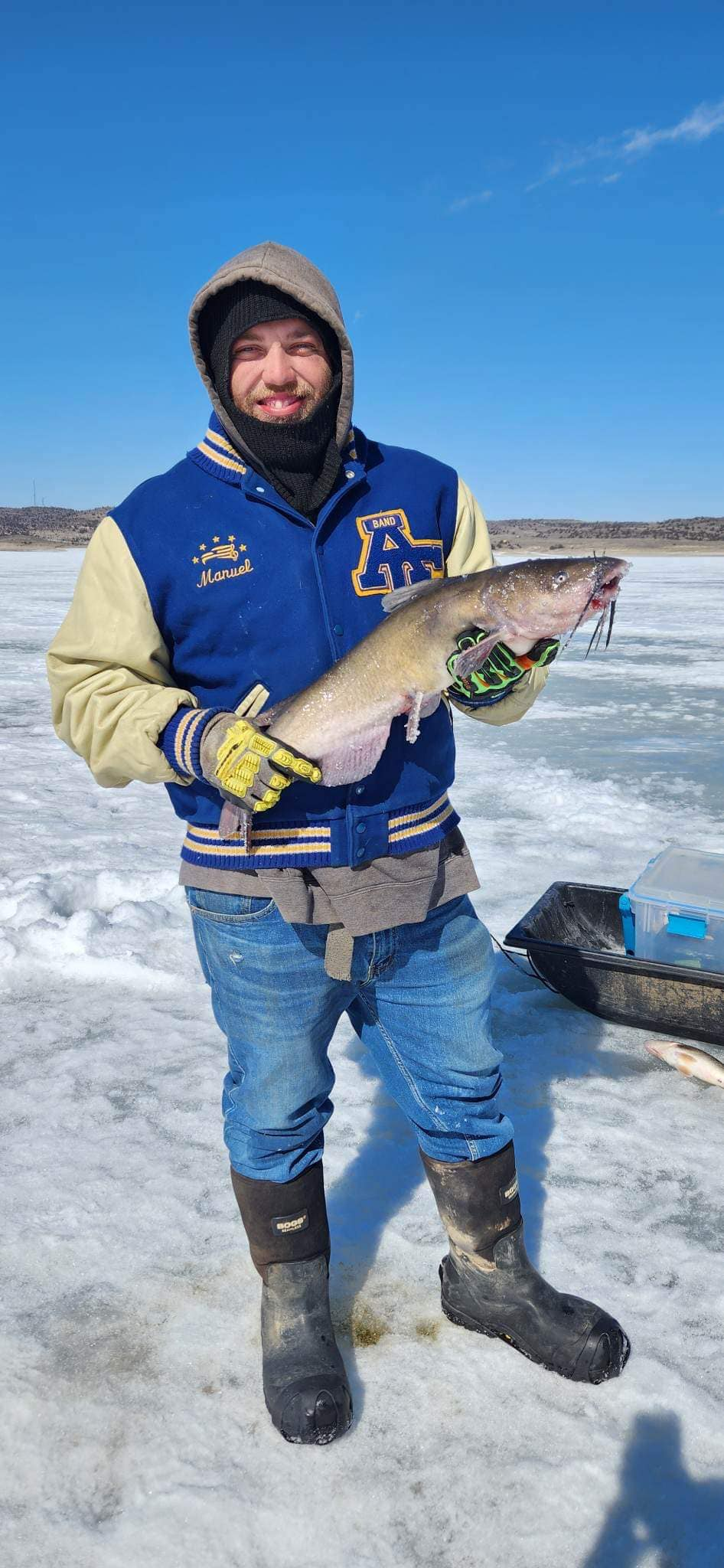 A person fishing in an unknown location