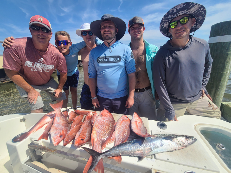 Huge King Mackerel and Red Snapper reeled in on a partly cloudy day!