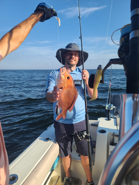 Reeling in a Red Snapper on a partly cloudy day!