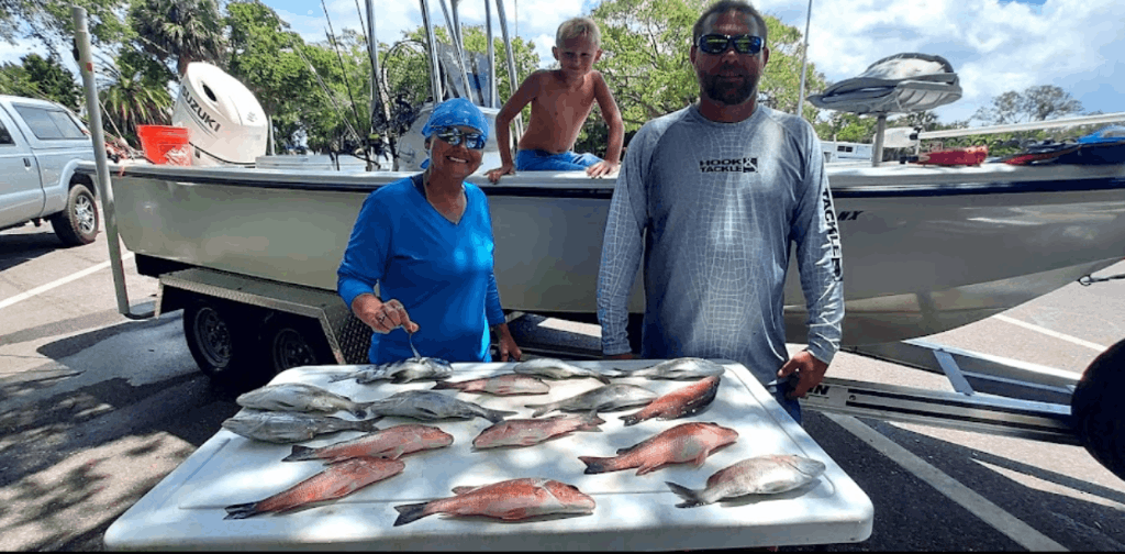 A group of 3 people fishing in an unknown location