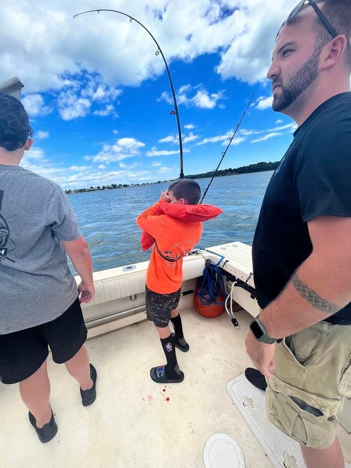 Fisherman catching fish in unknown location