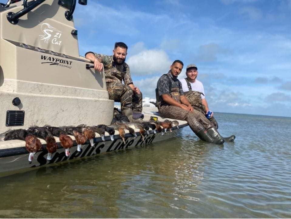 Four anglers fishing in an unknown location