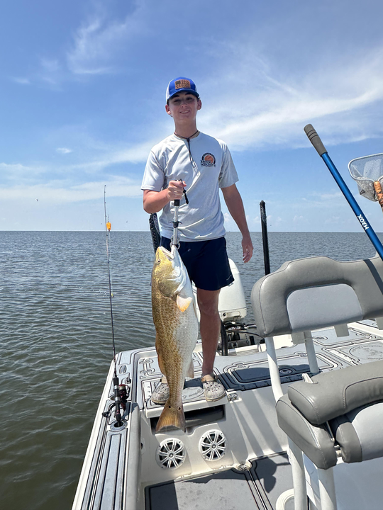 Huge redfish reeled in during a perfect day on the water!