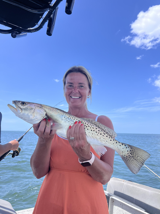 Catching the big one on a sunny day at sea.