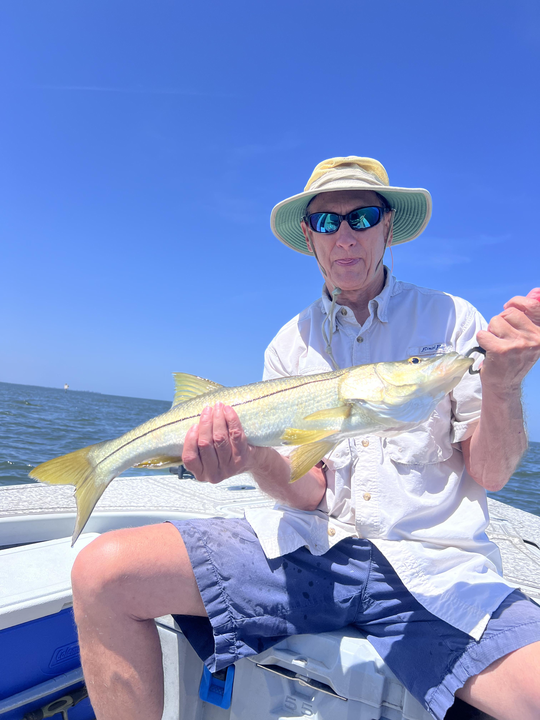 Reeling in another catch on the water.