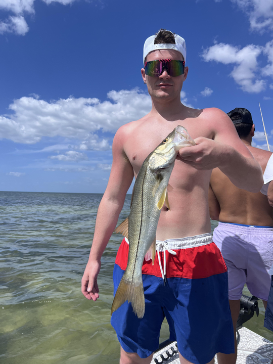 Reeling in a new catch on the coast.