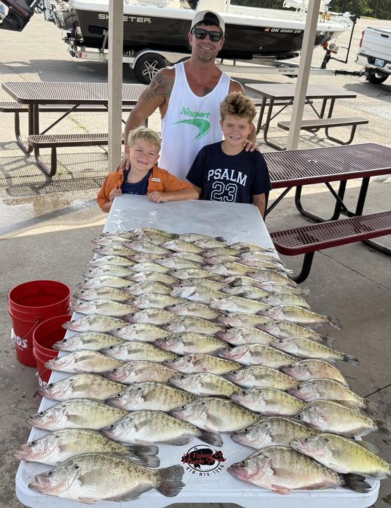 Huge white crappie doubles up on a partly cloudy day!