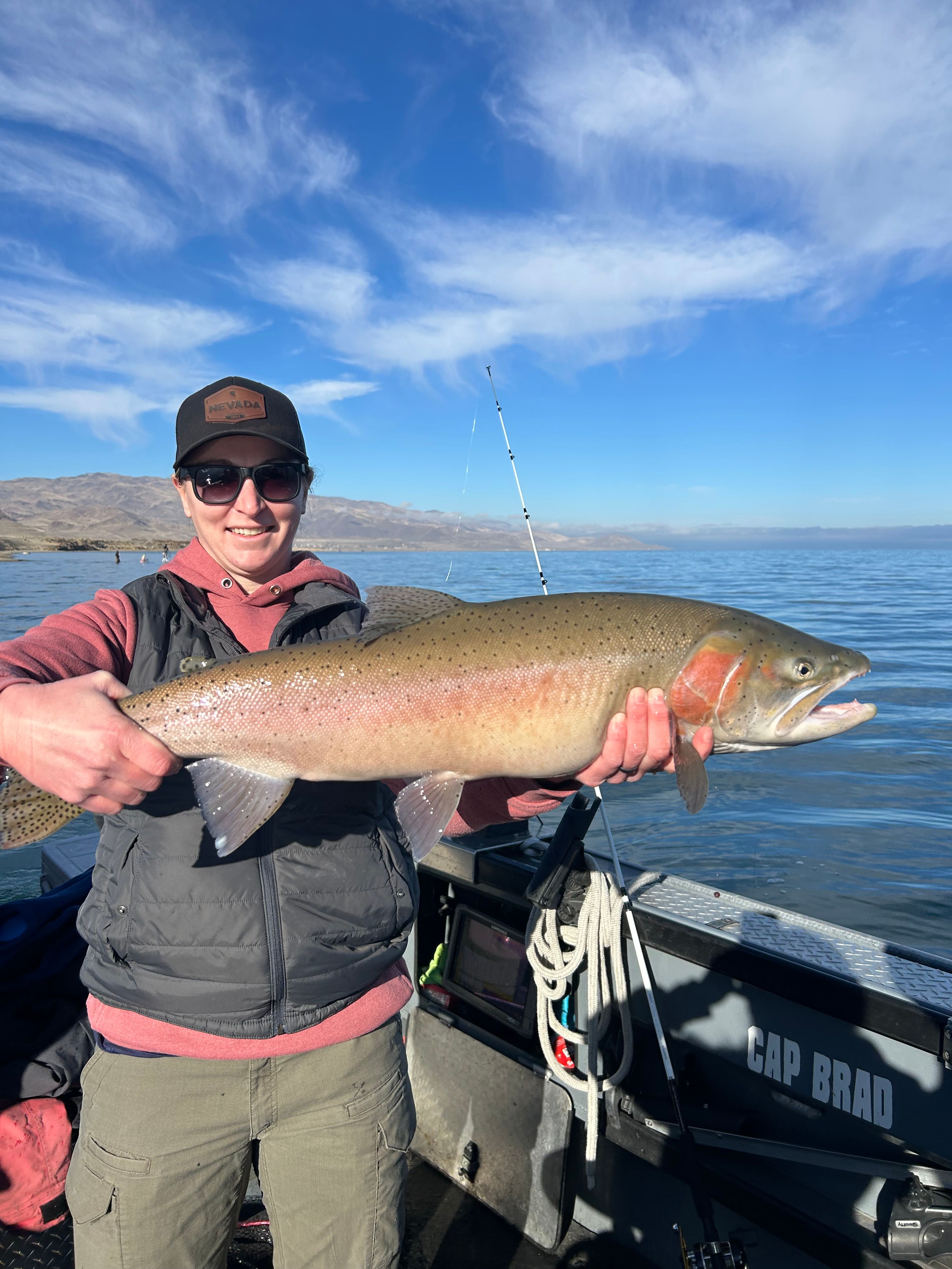 Fisherman holding a rainbow trout