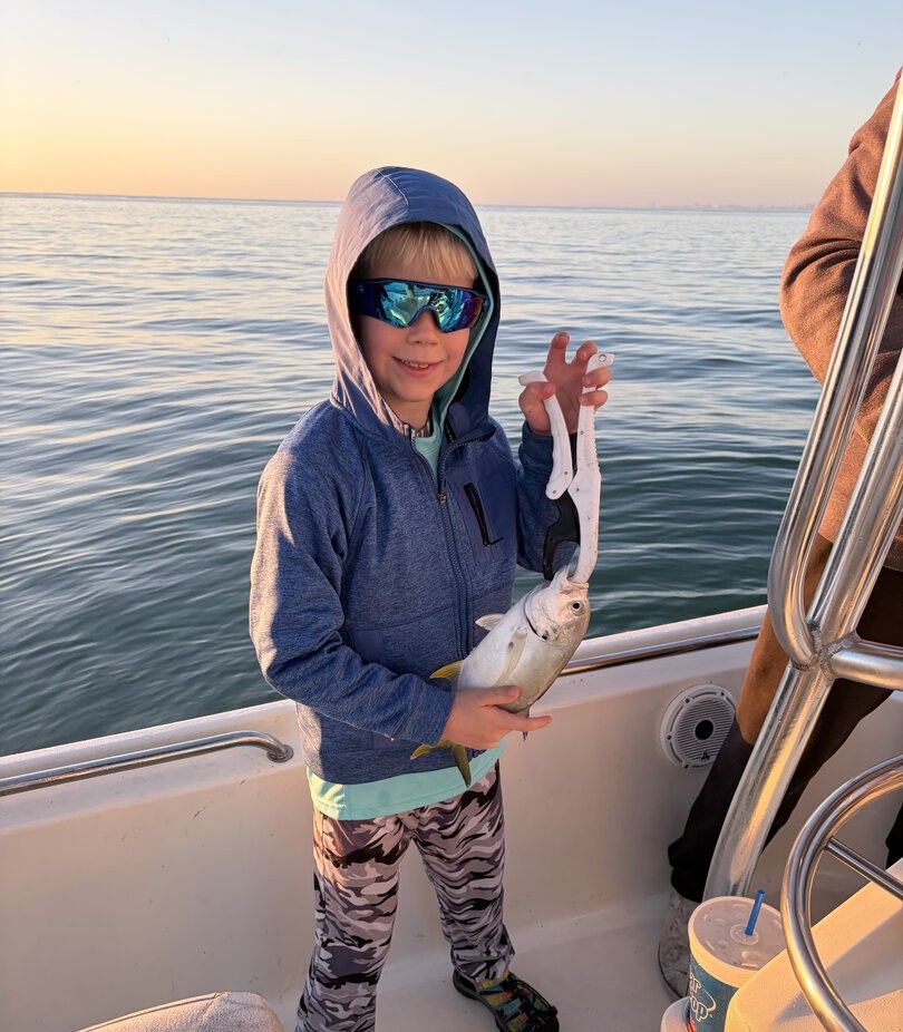 A person fishing in an unknown location