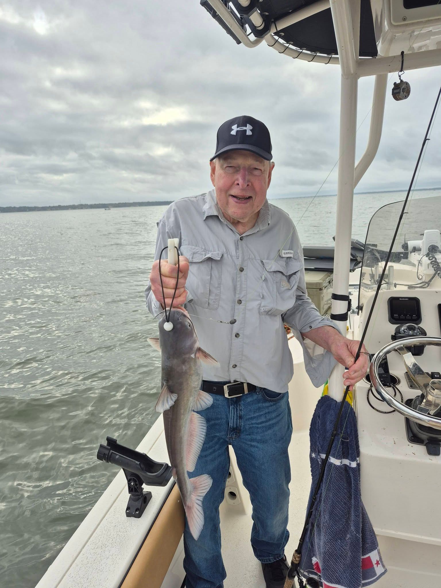 Angler fishing for a blue catfish