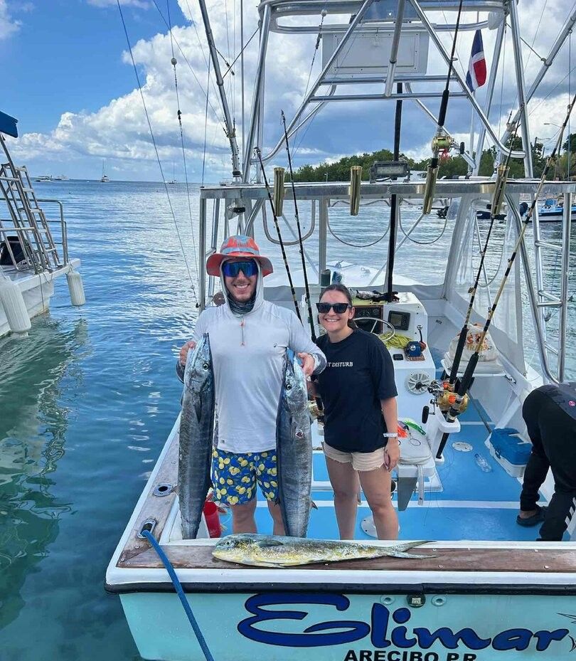 Two anglers enjoying a day of fishing at an unknown location
