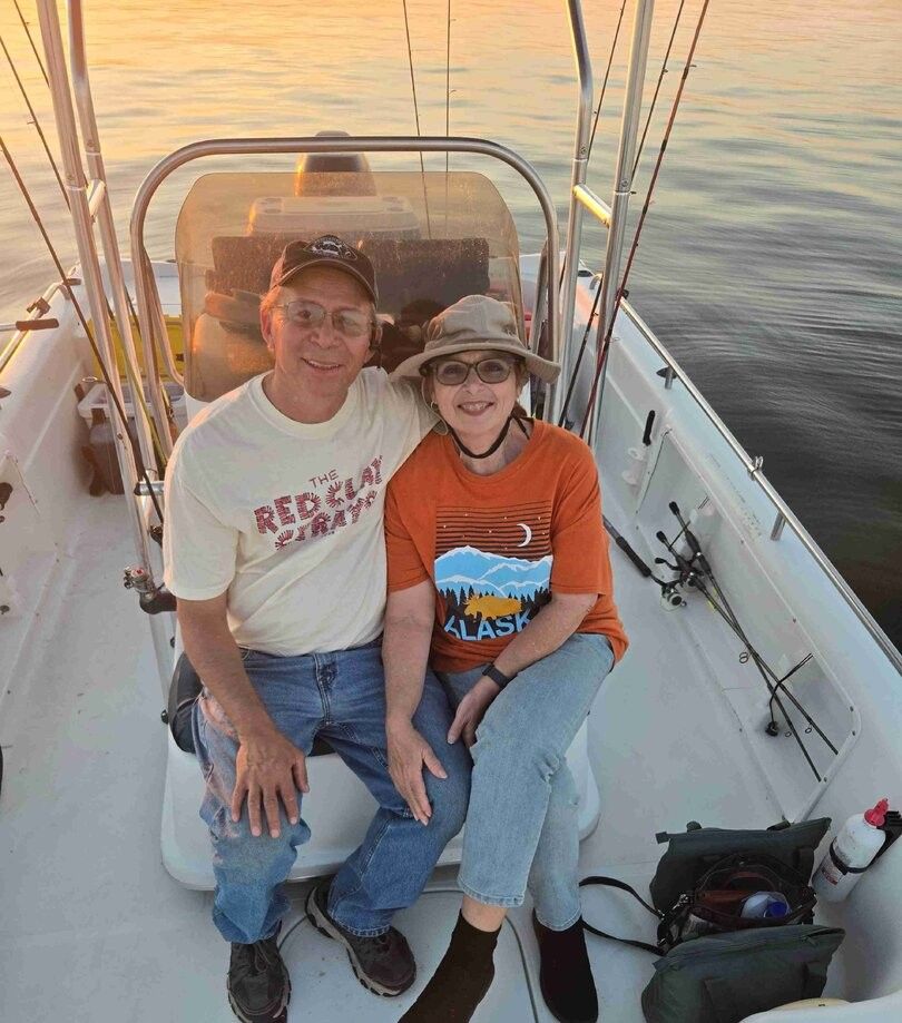 Two people fishing in a scenic location