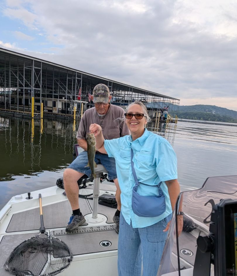 Two anglers fishing at unknown location