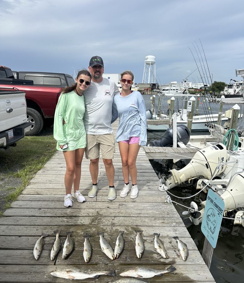Three anglers fishing in a scenic location