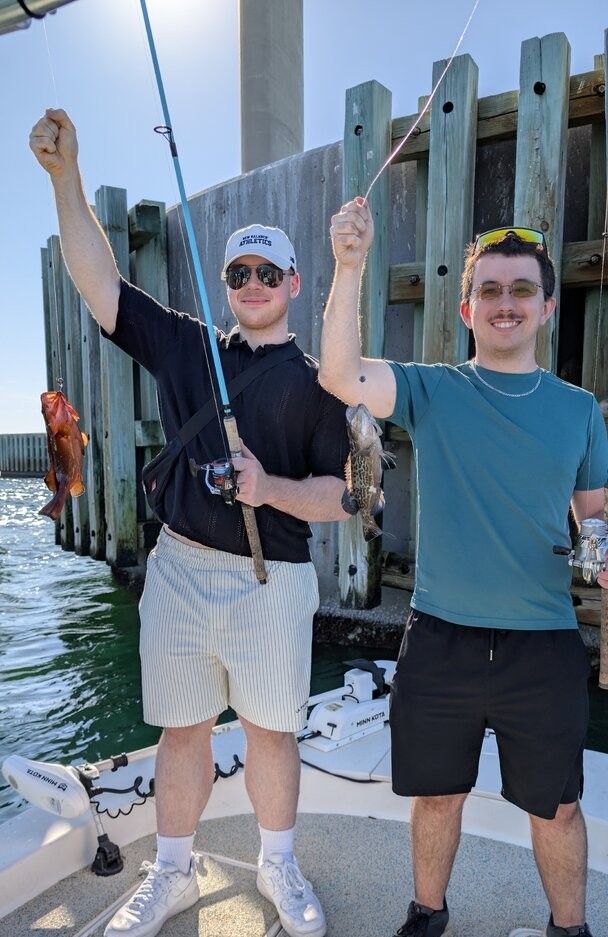 Two people fishing in an unknown location